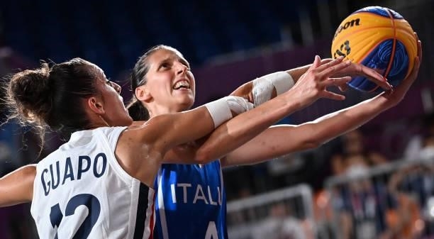France's Laetitia Guapo fights for the ball with Italy's Chiara Consolini during the women's first round 3x3 basketball match between France and...