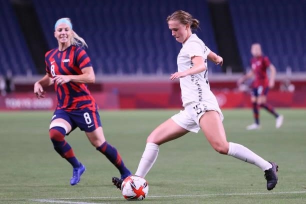 New Zealand's midfielder Daisy Cleverley clears the ball as she is marked by USA's midfielder Julie Ertz during the Tokyo 2020 Olympic Games women's...