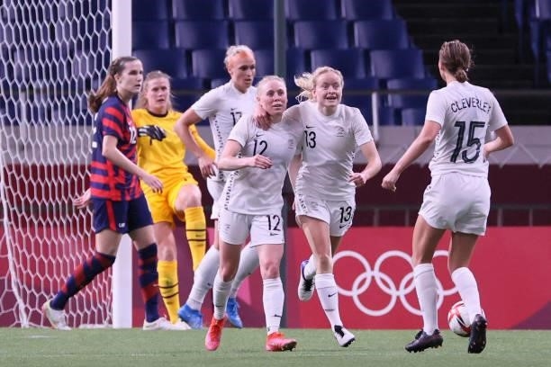 New Zealand's midfielder Betsy Hassett celebrates with teammates after scoring the third goal during the Tokyo 2020 Olympic Games women's group G...