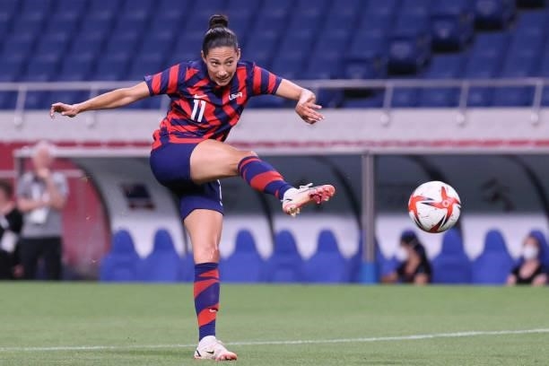 S forward Christen Press shoots to score the fourth goal during the Tokyo 2020 Olympic Games women's group G first round football match between New...