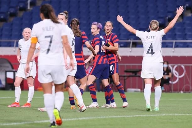S players celebrate their goal during the Tokyo 2020 Olympic Games women's group G first round football match between New Zealand and USA at the...