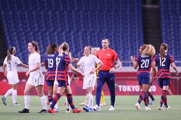 Players greet each other after the Tokyo 2020 Olympic Games women's group G first round football match between New Zealand and USA at the Saitama...