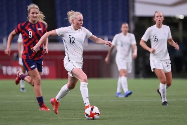 New Zealand's midfielder Betsy Hassett runs with the ball during the Tokyo 2020 Olympic Games women's group G first round football match between New...