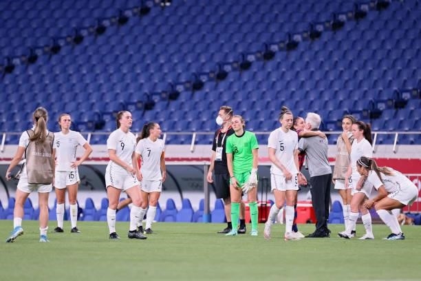 New Zealand's players react tp their loss following the Tokyo 2020 Olympic Games women's group G first round football match between New Zealand and...
