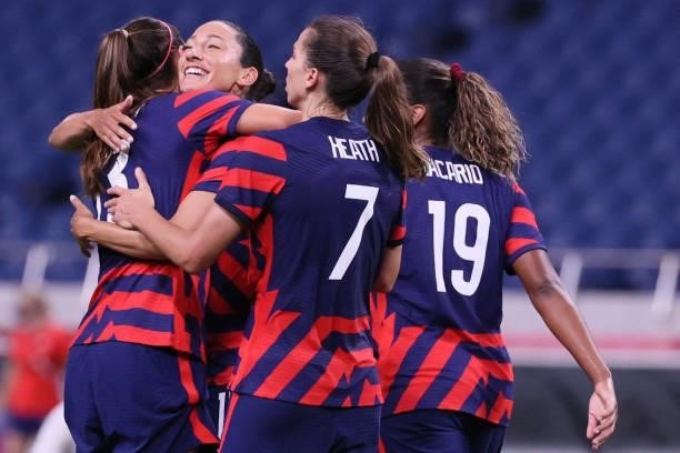 S forward Alex Morgan celebrates with teammates after scoring the fifth goal during the Tokyo 2020 Olympic Games women's group G first round football...