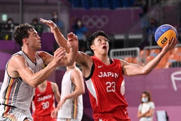 Belgium's Rafael Bogaerts fights for the ball with Japan's Ryuto Yasuoka during the men's first round 3x3 basketball match between Belgium and Japan...