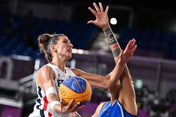 France's Laetitia Guapo fights for the ball with Italy's Marcella Filippi during the women's first round 3x3 basketball match between France and...
