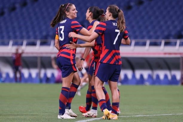 S forward Alex Morgan celebrates with teammates after scoring the fifth goal during the Tokyo 2020 Olympic Games women's group G first round football...