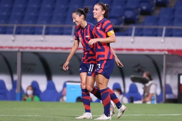 S forward Christen Press and USA's forward Alex Morgan celebrate their sixth goal during the Tokyo 2020 Olympic Games women's group G first round...