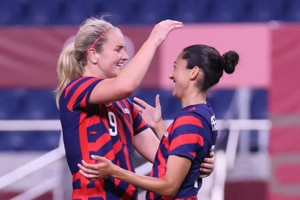 S forward Christen Press celebrates her goal with USA's midfielder Lindsey Horan during the Tokyo 2020 Olympic Games women's group G first round...
