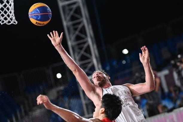 Japan's Ryuto Yasuoka fights for the ball with Belgium's Thierry Marien during the men's first round 3x3 basketball match between Belgium and Japan...