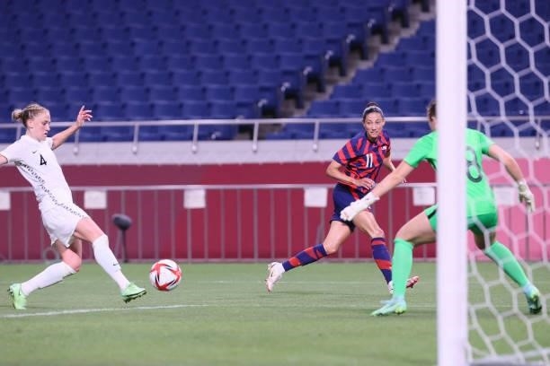 New Zealand's defender C. J. Bott diverts a pass from USA's forward Christen Press into her team's goal during the Tokyo 2020 Olympic Games women's...
