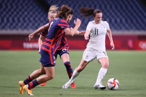 New Zealand's midfielder Olivia Chance is marked by USA's defender Emily Sonnett during the Tokyo 2020 Olympic Games women's group G first round...