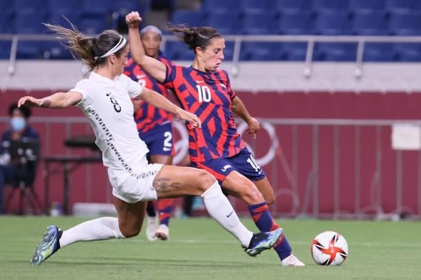 New Zealand's defender Abby Erceg tries to block a shot by USA's forward Carli Lloyd during the Tokyo 2020 Olympic Games women's group G first round...