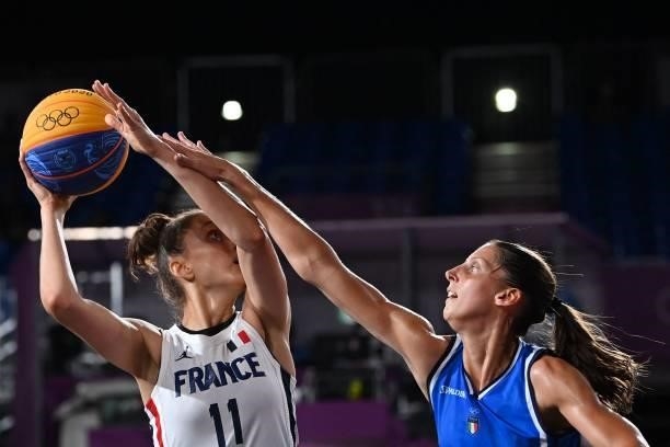 France's Ana Maria Filip fights for the ball with Italy's Chiara Consolini during the women's first round 3x3 basketball match between France and...