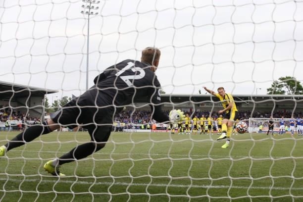 Daniel Iverson of Leicester City dives the right way during the penalty shoot out of the Pre-Season friendly between Burton Albion and Leicester City...
