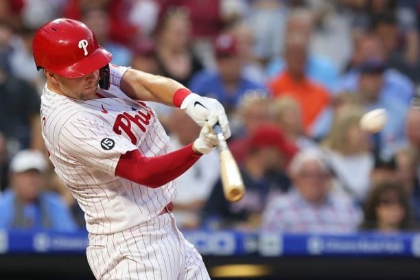 Rhys Hoskins of the Philadelphia Phillies hits an RBI double against the Atlanta Braves during the sixth inning of a game at Citizens Bank Park on...