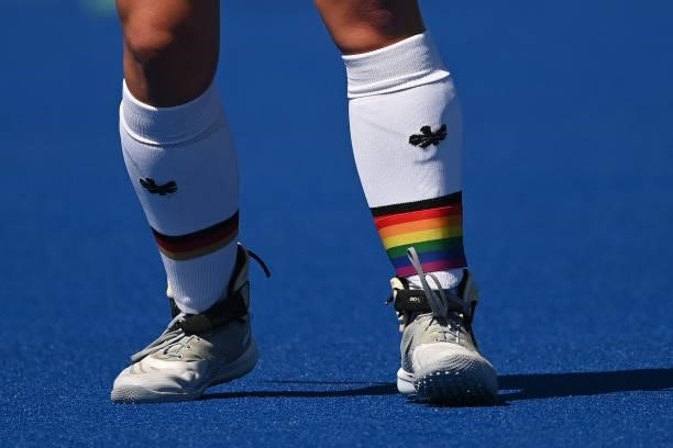 Germany's Nike Lorenz wears a rainbow-coloured band over a sock in support of the LGBTI movement and sexual diversity, during the women's pool A...