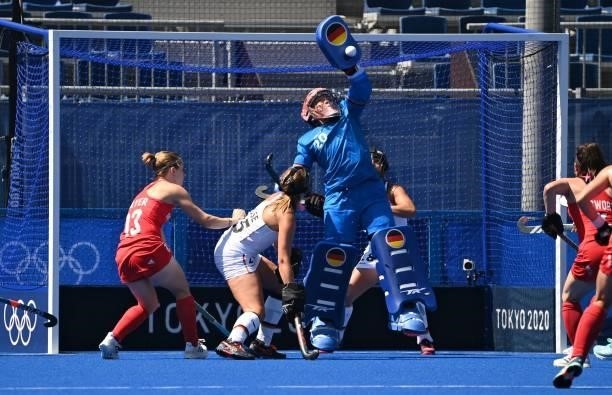 Germany's goalkeeper Julia Sonntag makes a save during the women's pool A match of the Tokyo 2020 Olympic Games field hockey competition against...