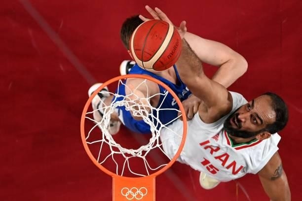 Iran's Hamed Haddadi goes to the basket in the men's preliminary round group A basketball match between Iran and Czech Republic during the Tokyo 2020...