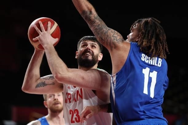 Iran's Aaron Geramipoor goes to the basket as Czech Republic's Blake Schilb watches in the men's preliminary round group A basketball match between...