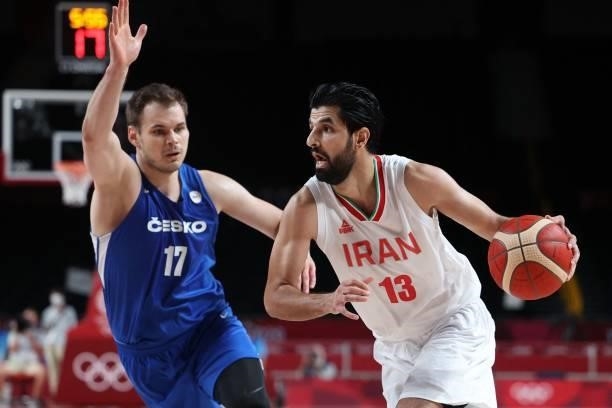 Iran's Mohammad Jamshidijafarabadi dribbles the ball past Czech Republic's Jaromir Bohacik in the men's preliminary round group A basketball match...