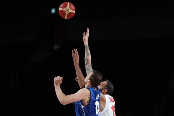Iran's Hamed Haddadi fights for the rebound with Czech Republic's Ondrej Balvin in the men's preliminary round group A basketball match between Iran...