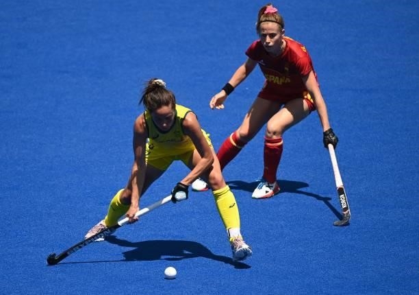 Australia's Brooke Peris is challenged by Spain's Berta Bonastre during their women's pool B match of the Tokyo 2020 Olympic Games field hockey...
