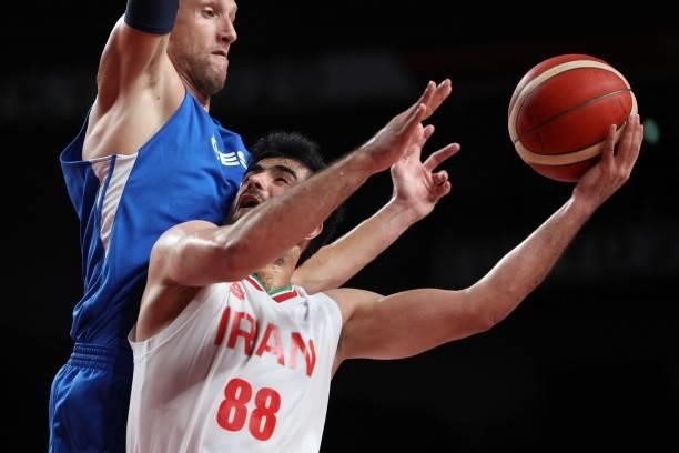 Iran's Behnam Yakhchalidehkordi goes to the basket in the men's preliminary round group A basketball match between Iran and Czech Republic during the...