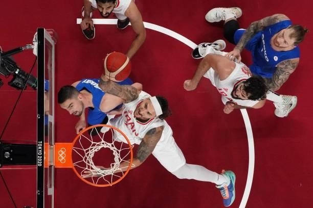 Iran's Michael Rostampour goes to the basket in the men's preliminary round group A basketball match between Iran and Czech Republic during the Tokyo...