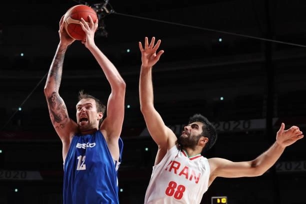 Czech Republic's Ondrej Balvin goes to the basket as Iran's Behnam Yakhchalidehkordi tries to block in the men's preliminary round group A basketball...