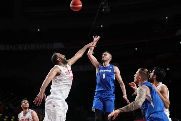Iran's Hamed Haddadi and Czech Republic's Tomas Satoransky jump for he ball in the men's preliminary round group A basketball match between Iran and...
