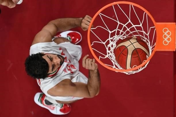 Iran's Mohammadsamad Nik Khahbahrami scores a basket in the men's preliminary round group A basketball match between Iran and Czech Republic during...
