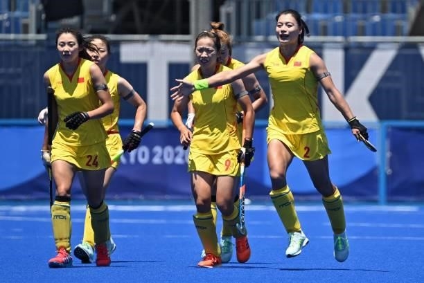 China's Gu Bingfeng celebrates after scoring against Japan during their women's pool B match of the Tokyo 2020 Olympic Games field hockey...