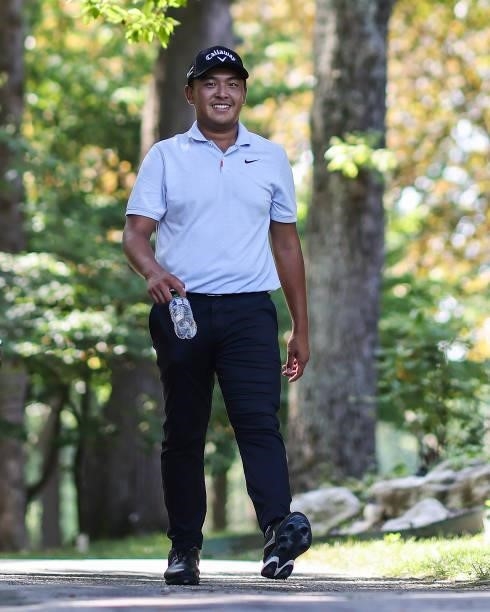 Kevin Yu of Chinese Taipei looks on as he walks to the 18th tee during the third round of the Price Cutter Charity Championship presented by Dr....