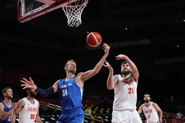 Czech Republic's Jan Vesely and Iran's Aaron Geramipoor fight for the rebound in the men's preliminary round group A basketball match between Iran...
