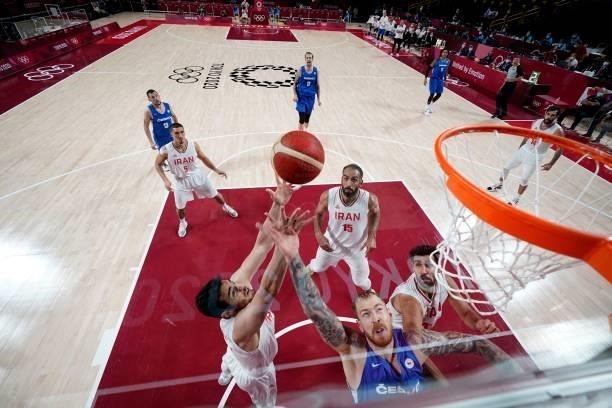 Czech Republic's Patrik Auda fights for the rebound with Iranian players in the men's preliminary round group A basketball match between Iran and...