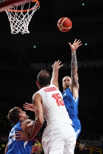 Iran's Hamed Haddadi jumps for the ball in the men's preliminary round group A basketball match between Iran and Czech Republic during the Tokyo 2020...