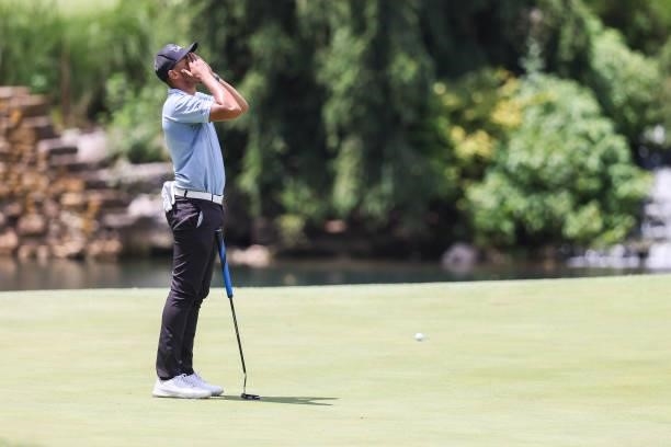 Chase Johnson reacts after missing a putt on the 8th green during the third round of the Price Cutter Charity Championship presented by Dr. Pepper at...