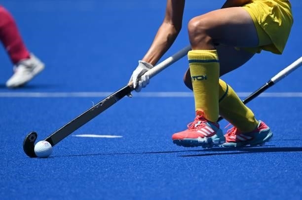 Player of China takes the ball during the women's pool B match of the Tokyo 2020 Olympic Games field hockey competition against Japan, at the Oi...