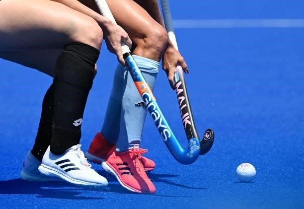 Players of New Zealand and Argentina vie for the ball during their women's pool B match of the Tokyo 2020 Olympic Games field hockey competition, at...