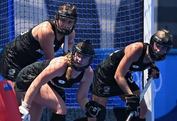 Players of New Zealand defend their goal during a penalty corner during the women's pool B match of the Tokyo 2020 Olympic Games field hockey...