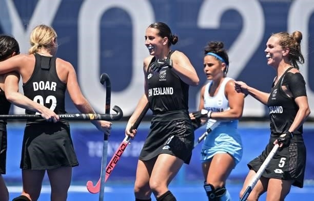 New Zealand's Katie Doar, Stephanie Dickins and Frances Davies celebrate after teammate Kelsey Smith opened the score against Argentina during their...