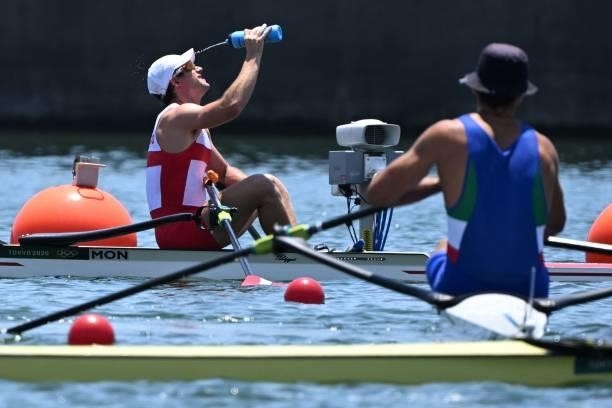 Monaco's Quentin Antognelli cools down after competing in the men's single sculls quarterfinal during the Tokyo 2020 Olympic Games at the Sea Forest...