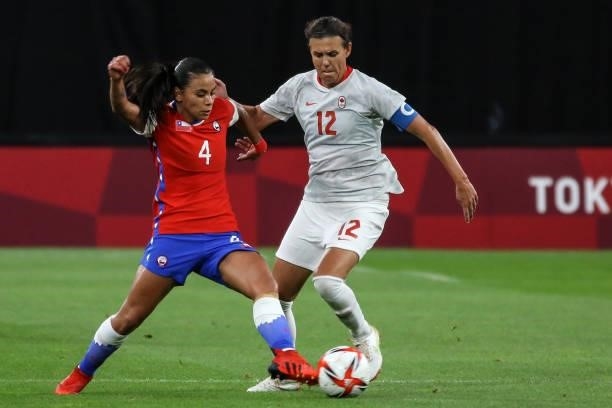 Christine SINCLAIR of Team Canada battles for possession with Francisca LARA of Team Chile during the Women's First Round Group E match between Chile...