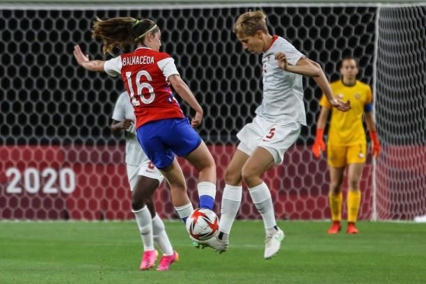 Of Team Canada battles for possession with Rosario BALMACEDA of Team Chile during the Women's First Round Group E match between Chile and Canada on...