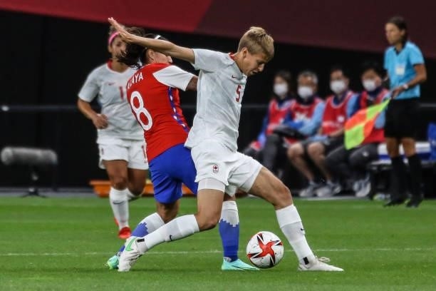 Of Team Canada battles for possession with Karen ARAYA of Team Chile during the Women's First Round Group E match between Chile and Canada on day one...
