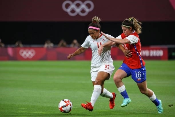 Desiree SCOTT of Team Canada battles for possession with Rosario BALMACEDA of Team Chile during the Women's First Round Group E match between Chile...