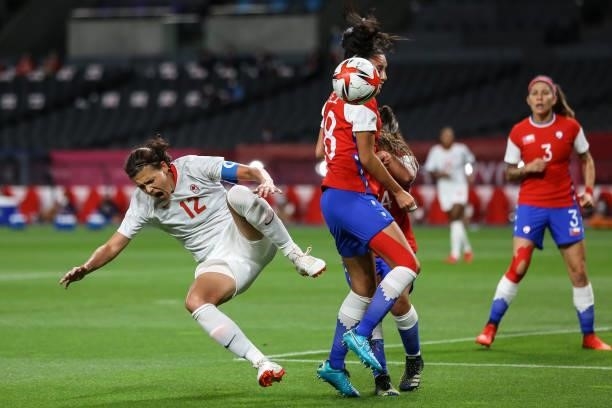 Christine SINCLAIR of Team Canada battles for possession with Daniela ARDO Karen ARAYA of Team Chile during the Women's First Round Group E match...