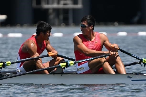 China's Liu Zhiyu and China's Zhang Liang react after the men's double sculls semi-final during the Tokyo 2020 Olympic Games at the Sea Forest...